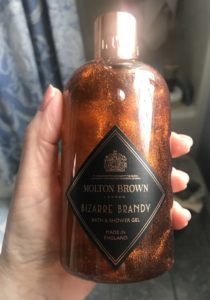 closeup of copper colored Molton Brown Bizarre Brandy Shower Gel bottle