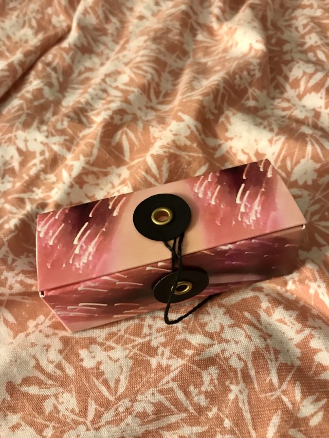 the wrapped string closure on the Pat McGrath LuxeTrance lipstick box