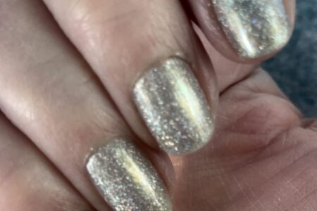 my nails wearing silver holo with a touch of gold, sparkly Alicia from Zoya