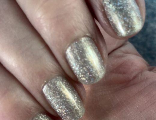 my nails wearing silver holo with a touch of gold, sparkly Alicia from Zoya