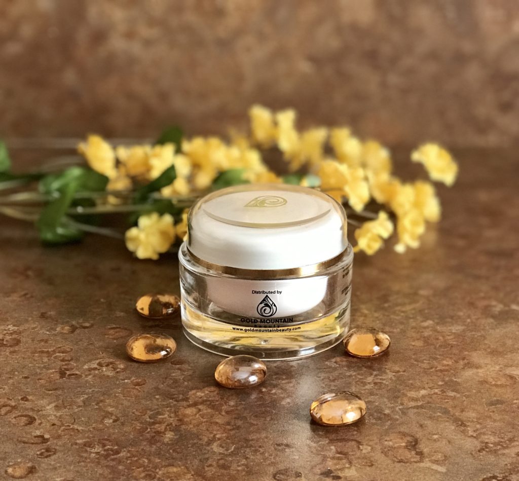 clear, heavy plastic jar of Gold Mountain Beauty Rose Moisturizer with Hyaluronic Acid and Diamond Dust