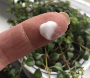 white blob on my finger of Kopari Coconut Face Cream