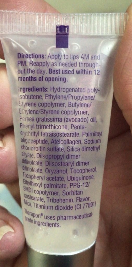 closeup of the back of the tube of Theraderm Anti-Aging Lip Complex with the ingredient list & instructions 