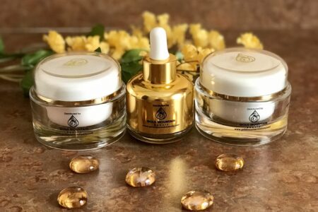 bottle and two jars of skincare products from Gold Mountain Beauty