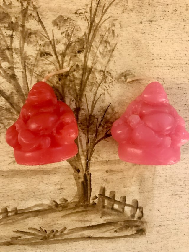 pink and red mini Buddha shaped candles