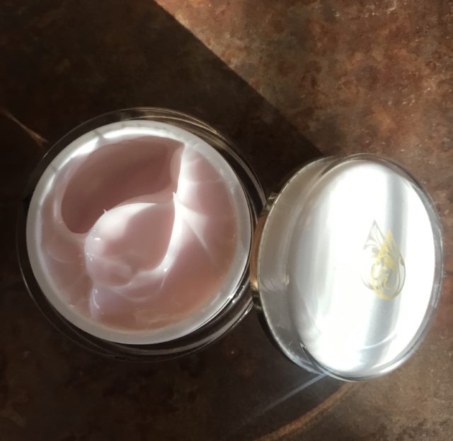 open jar showing light pink cream: Gold Mountain Beauty Rose Moisturizer with Hyaluronic Acid and Diamond Dust