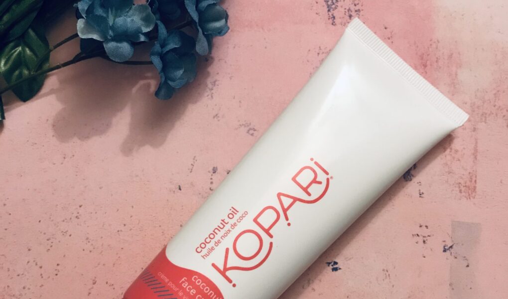 white & red tube of Kopari Coconut Face Cream