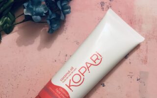 white & red tube of Kopari Coconut Face Cream