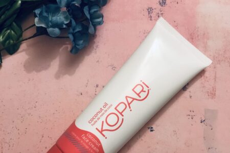 white & red tube of Kopari Coconut Face Cream