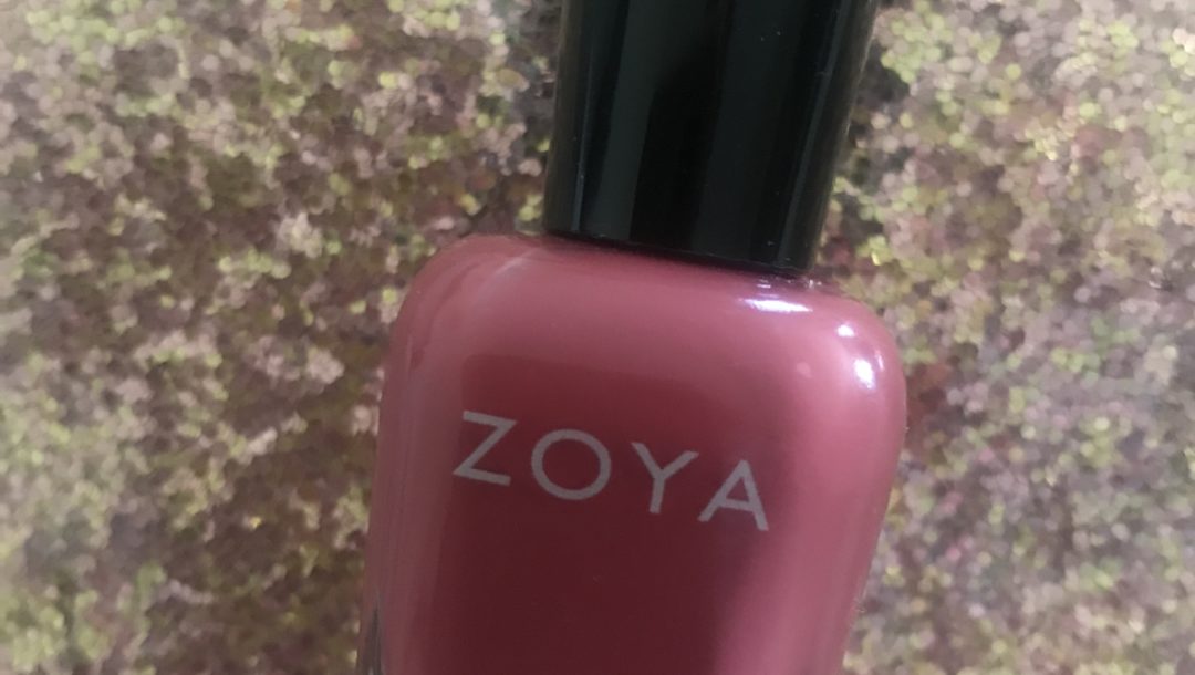 bottle of Zoya "Briar" nail polish, a red terra-cotta cream polish
