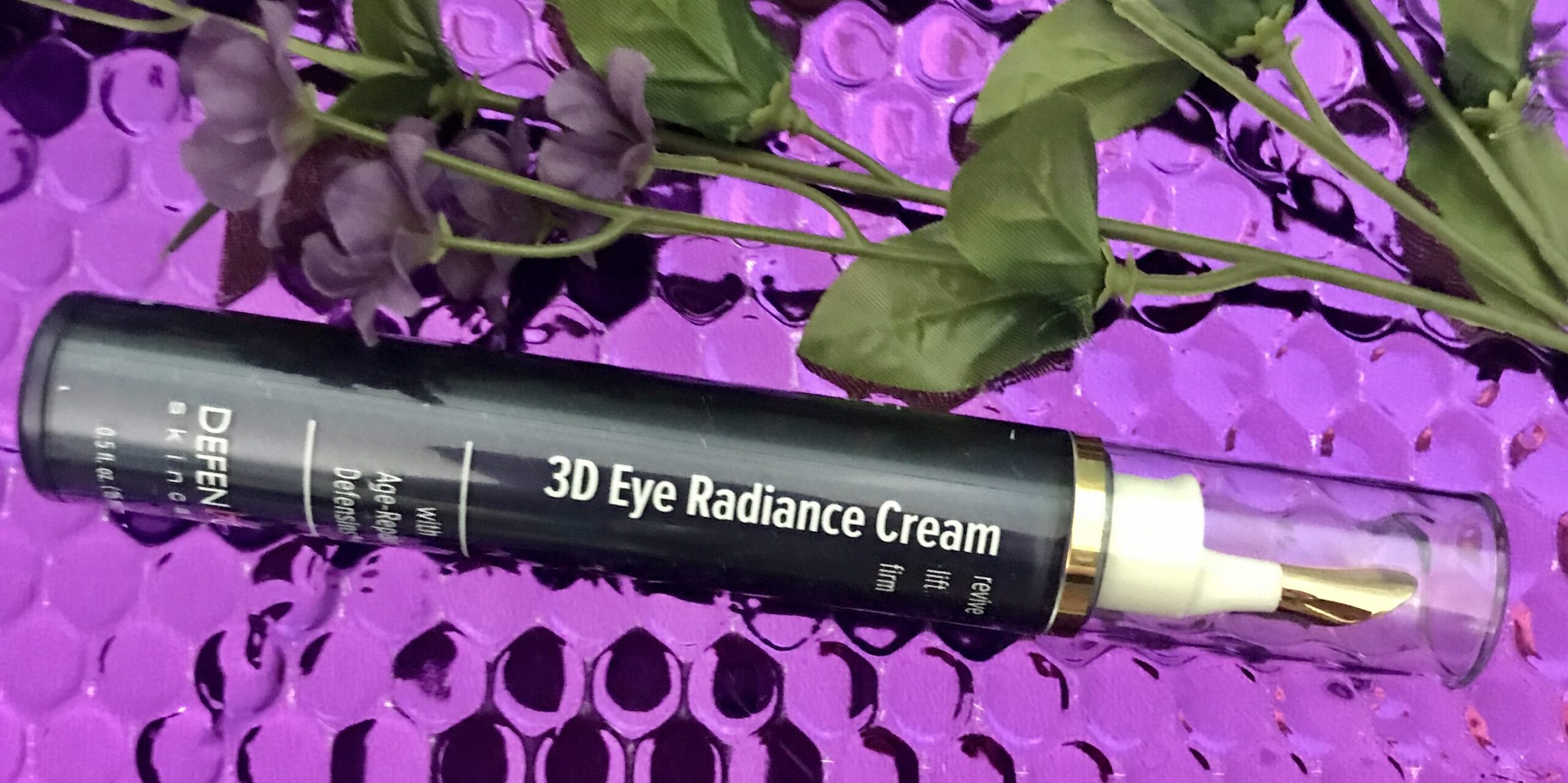 closeup tube of DefenAge 3D Radiance Eye Cream