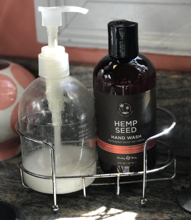 bottle of Hemp Seed Hand Wash in a caddy with a bottle of hand lotion near my sink
