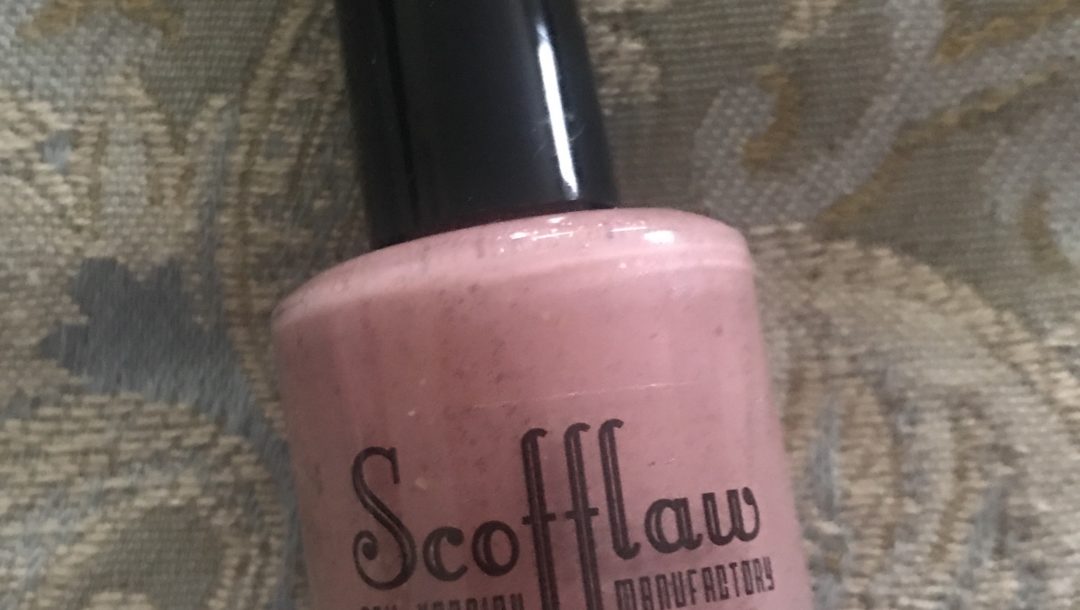 bottle of pink-mauve w gold flakes Scofflaw Nail Varnish shade Leda and the Swan