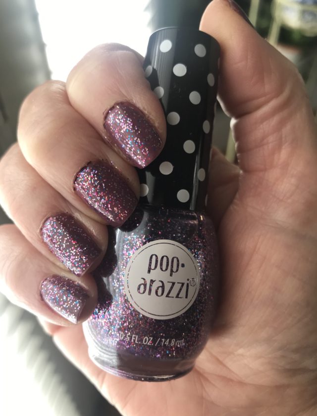 my nails wearing Poparazzi Seeing Sparkles, a purple glitter topper, on top of Zoya Joni, a dusty plum cream nail polish