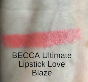 arm swatch of pink-coral Blaze BECCA Ultimate Lipstick Love