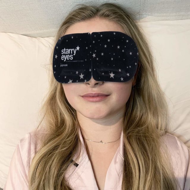 woman wearing Popmask Starry Eyes Self-Warming Sleep Mask