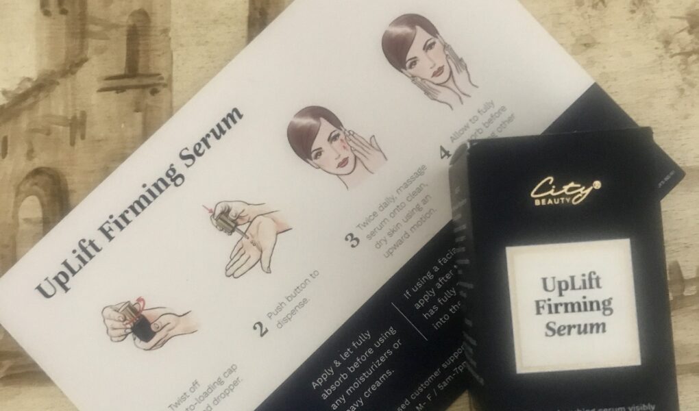 City Beauty UpLift Firming Serum in its outer packaging and product card that explains how to apply it