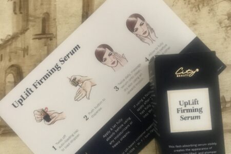 City Beauty UpLift Firming Serum in its outer packaging and product card that explains how to apply it