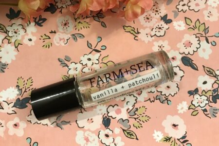 closeup of Farm + Sea Vanilla + Patchouli Roll-on Perfume Oil vial