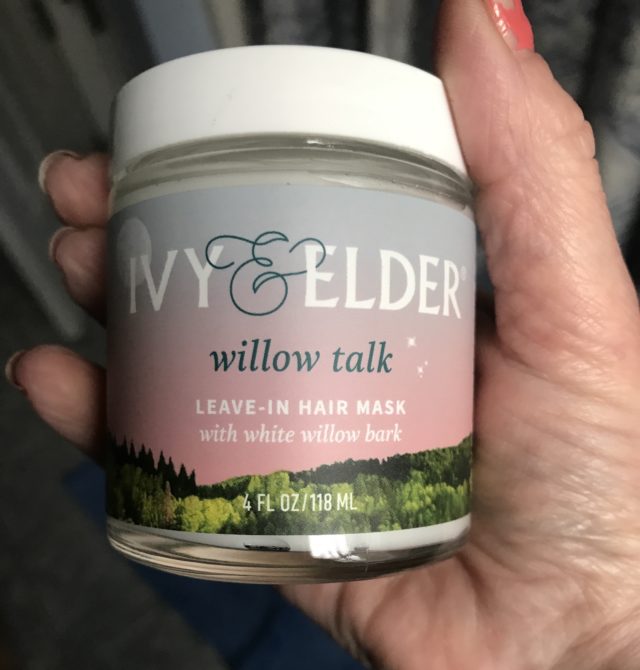 my hand holding a jar of Ivy & Elder Willow Bark Leave-In Hair Mask