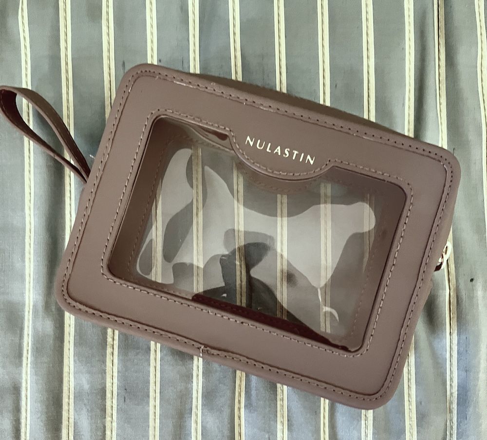 empty Nulastin travel case with two clear plastic windows